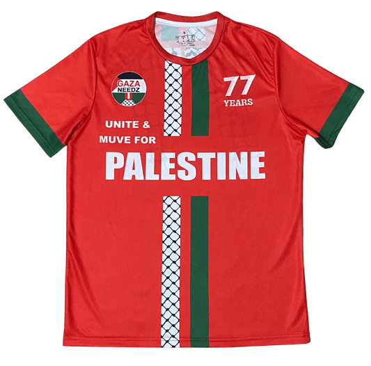 Red Palestine football jersey with green and keffiyeh stripes, Gaza Needs You emblem on left chest, 77 Years logo on right chest, and bold Palestine text across the middle